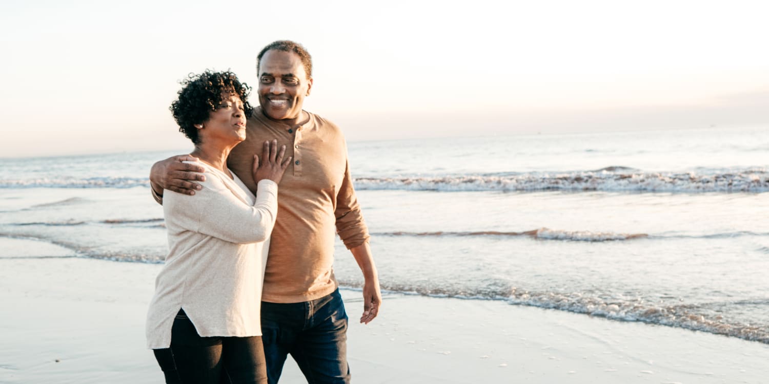 a couple walking on the beach