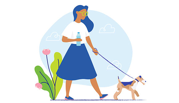 woman walking dog in the afternoon