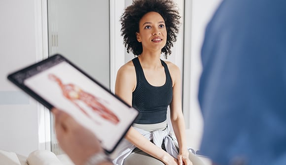 Young adult seeing primary care doctor