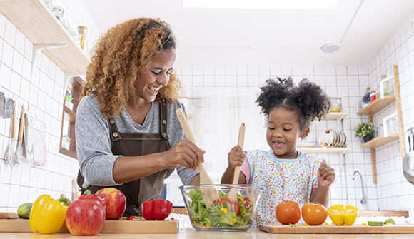A mother and daughter cooking for diabetes