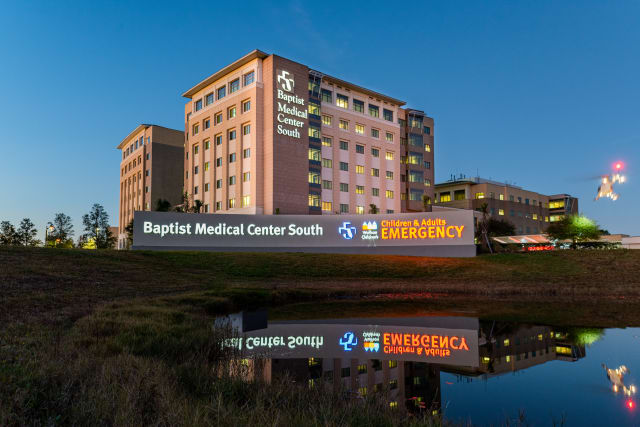 exterior photo of Baptist Medical Center South at night