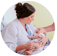 mom and baby in hospital labor and delivery maternity suite