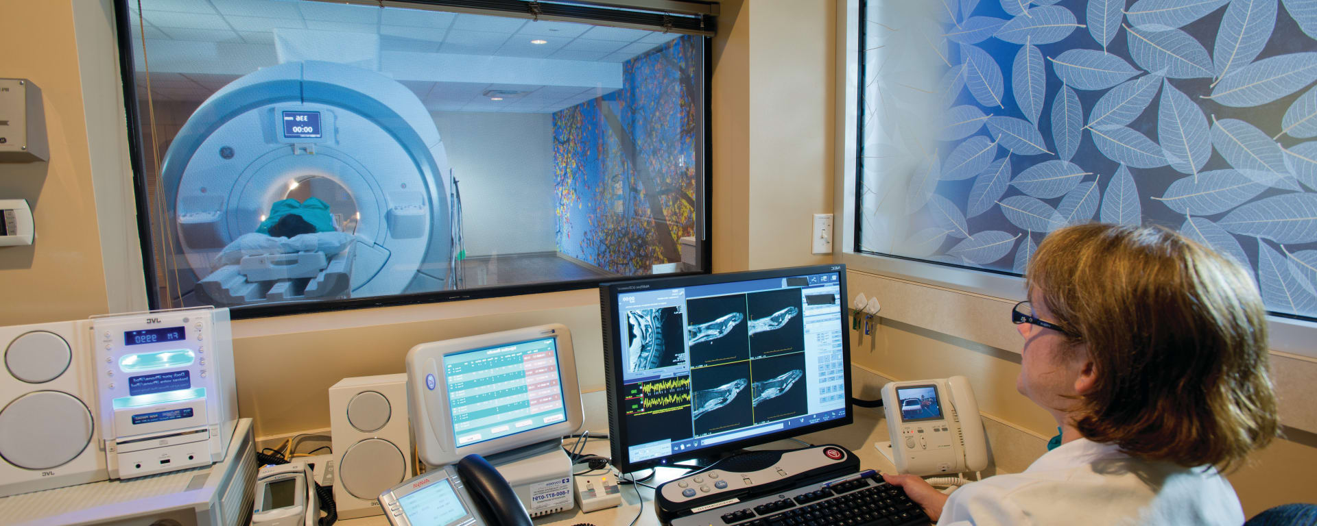 patient in an MRI scanner from the healthcare worker's station