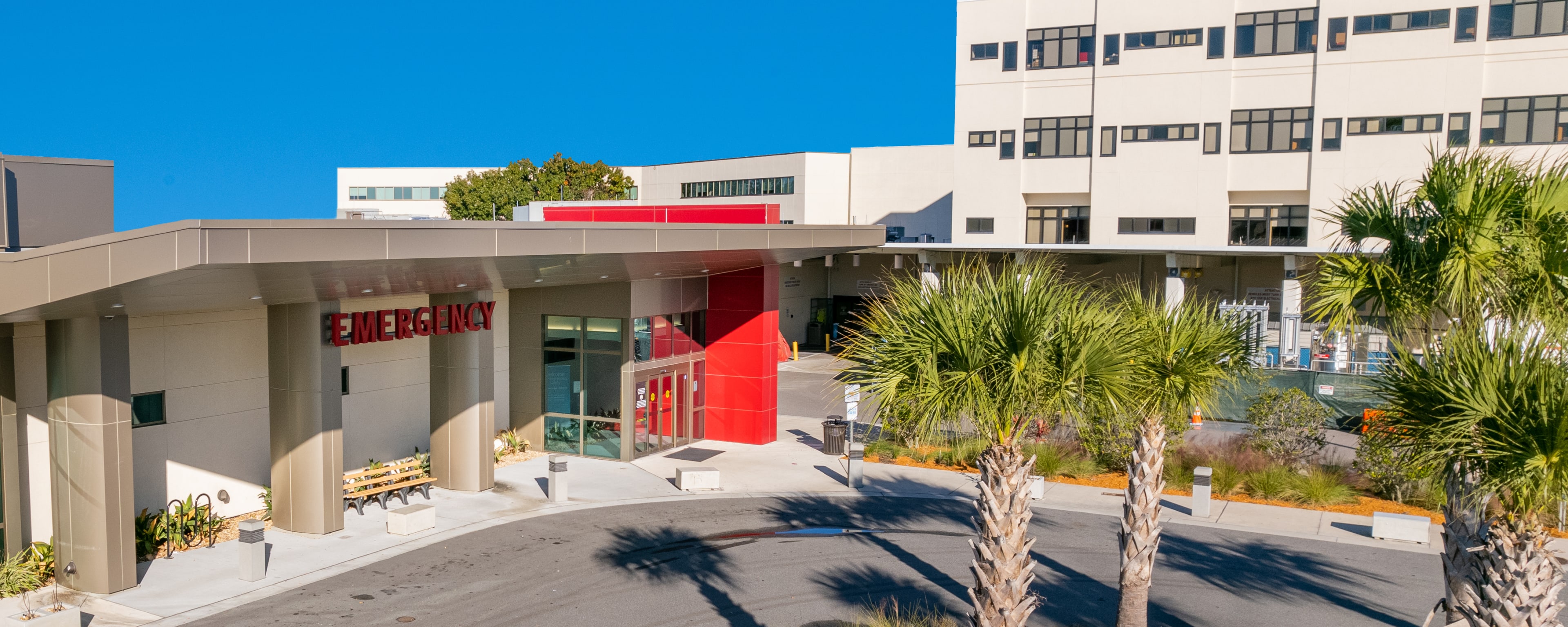 Exterior view of the emergency room at Baptist Medical Center Beaches. Large sign reads "Emergency"