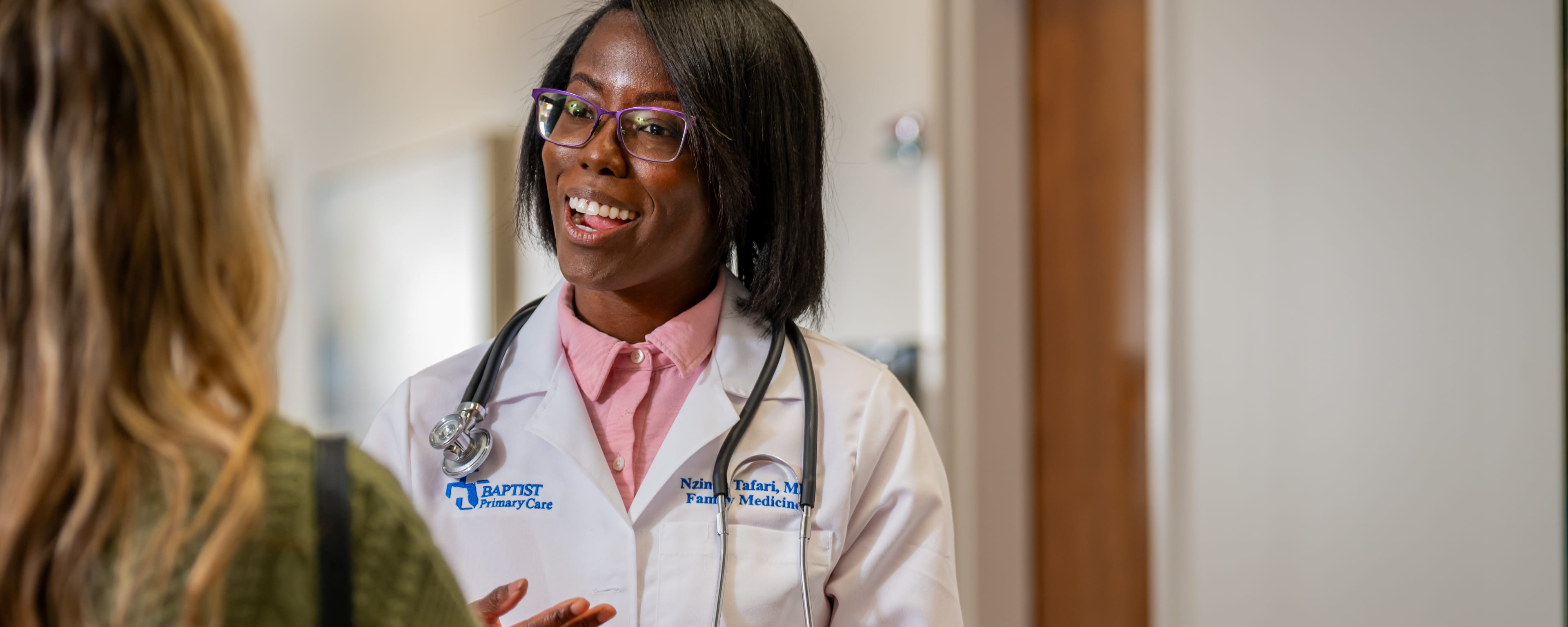 a Baptist Health Primary Care doctor speaks with a patient in Jacksonville, Florida.