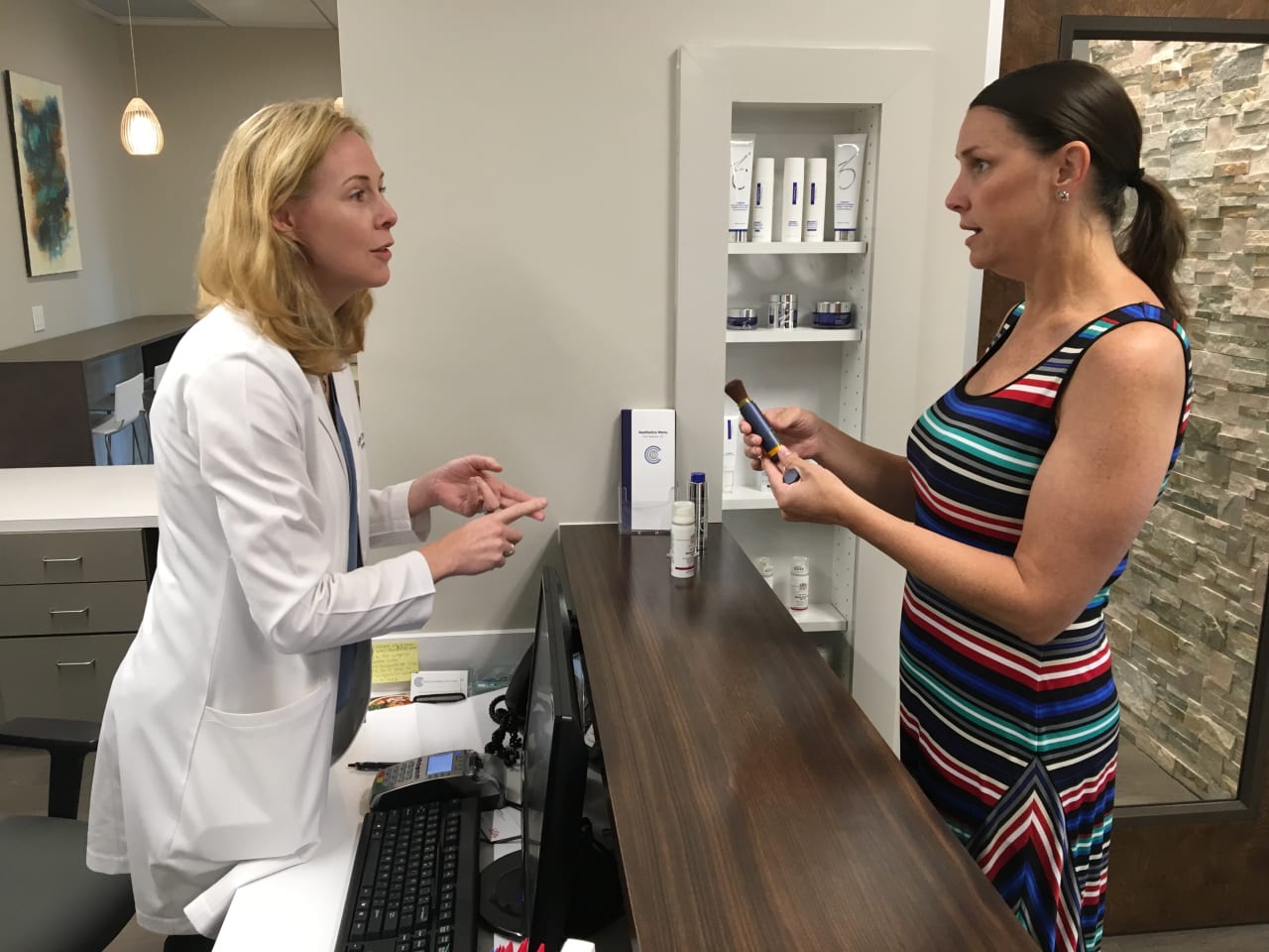 skin cancer survivor speaks to dermatologist