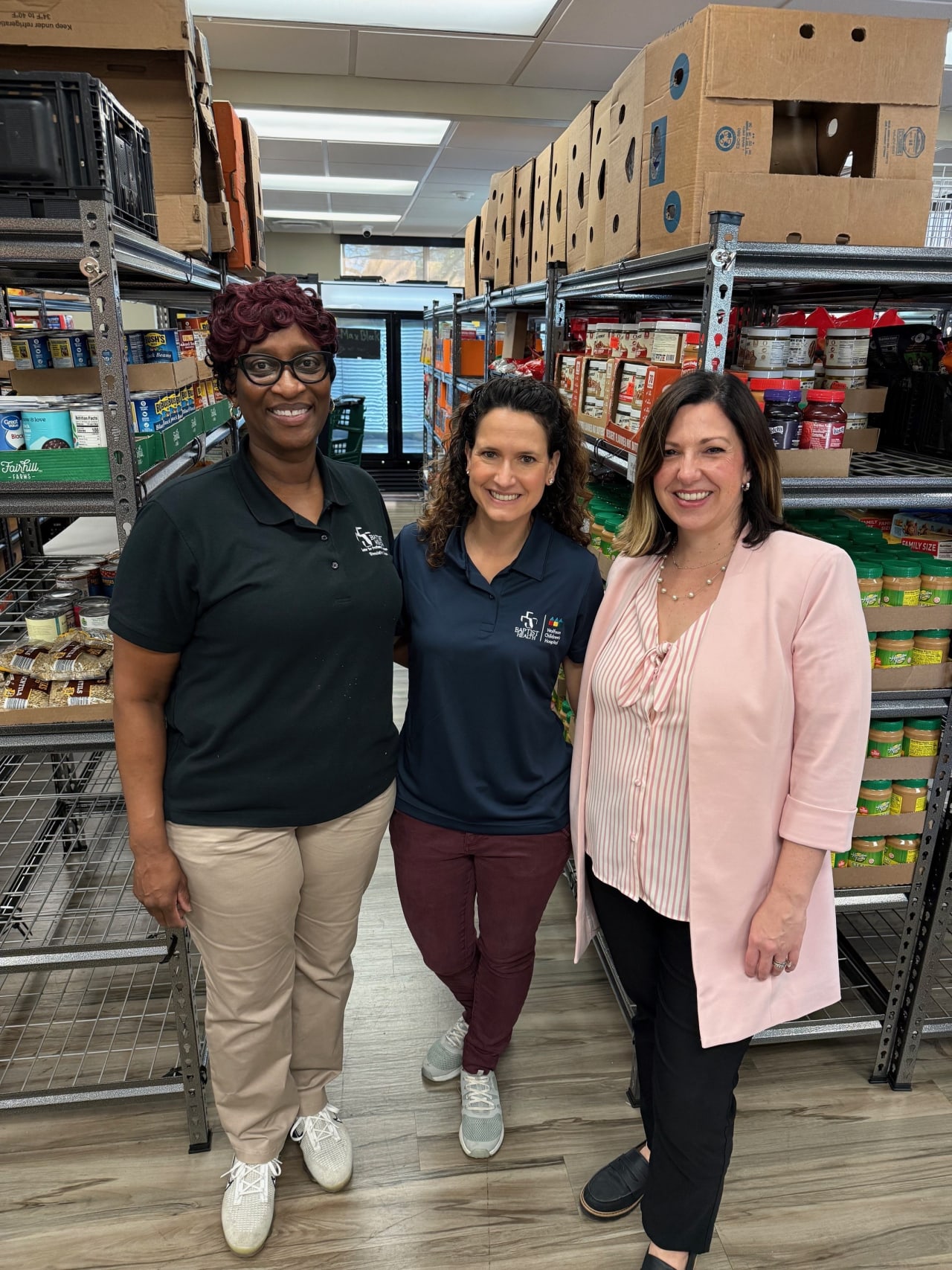 Baptist Health team in warehouse volunteering.