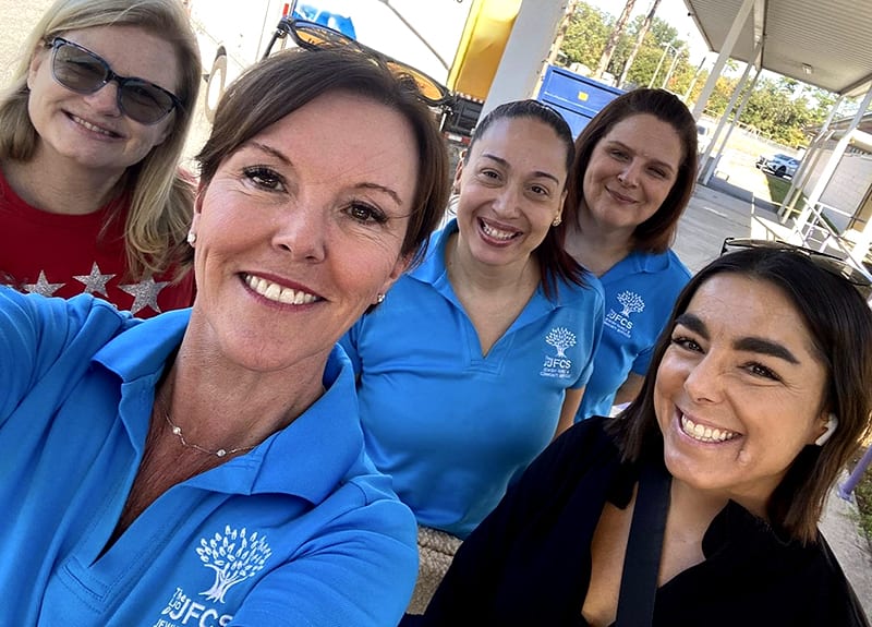 JFCS CEO Colleen Lloyd Rodriguez with team and volunteers.