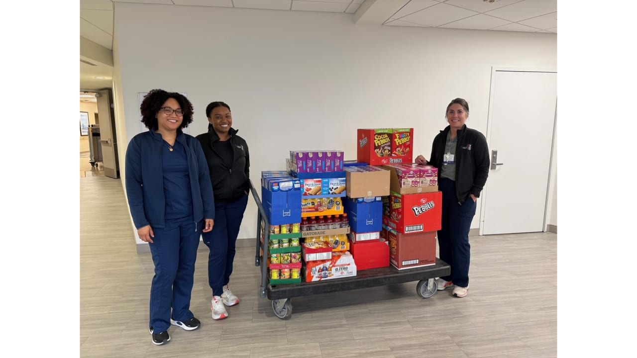 Baptist Health team members with food collected.