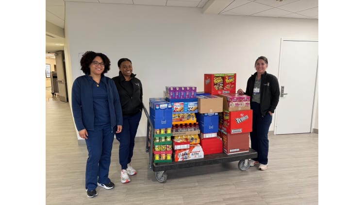 Baptist Health team members with food collected.