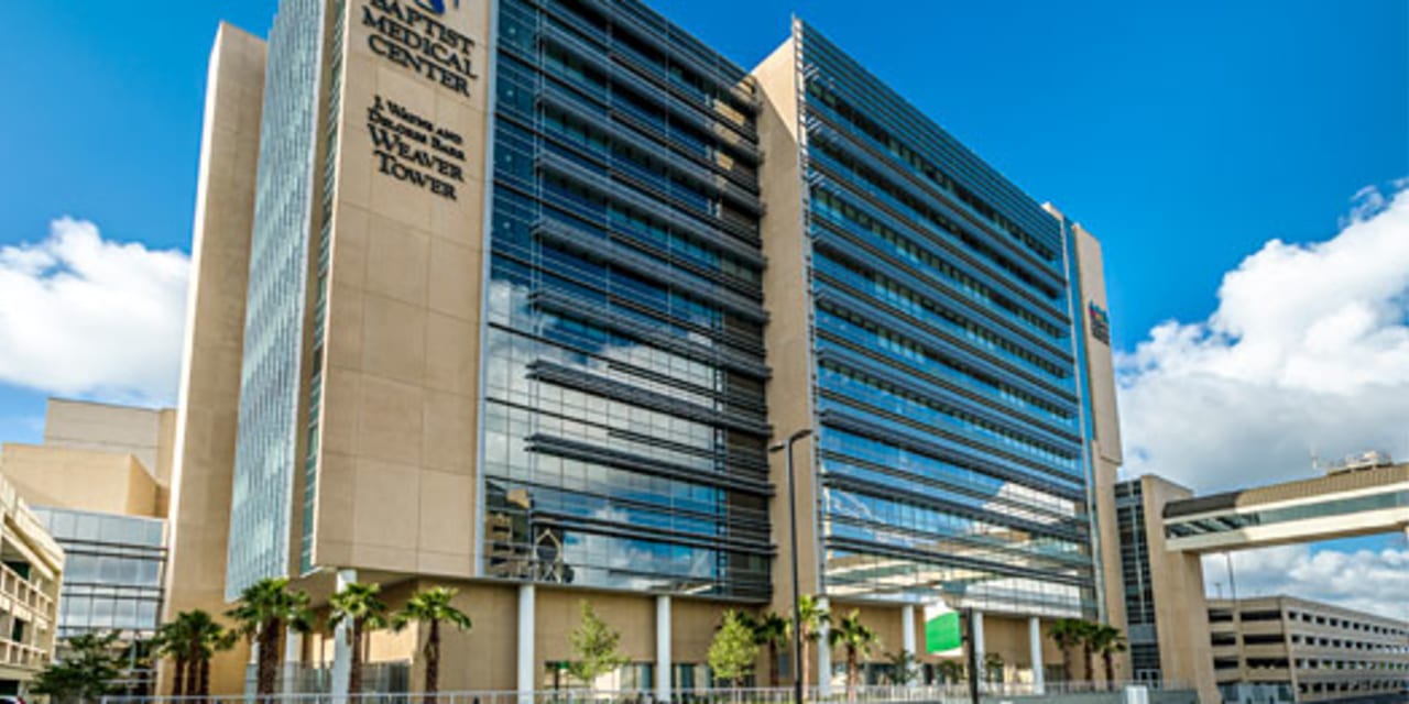 baptist medical center jacksonville building exterior with blue sky and clouds in the background