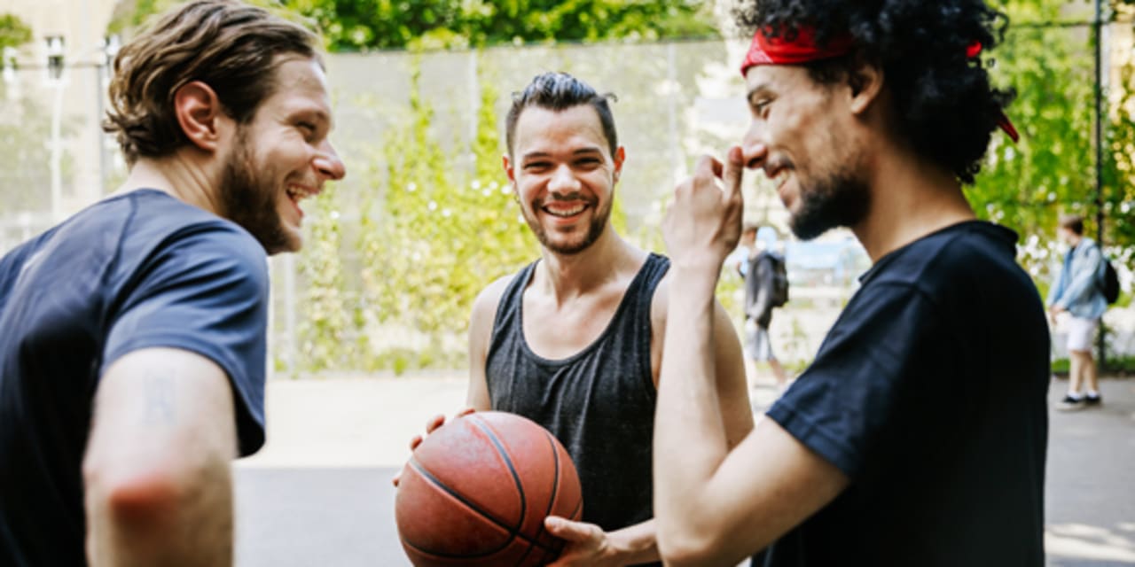 men playing basketball as a form of self care