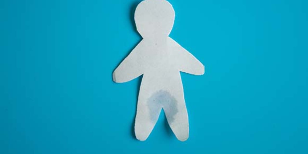 Paper cutout of a man that's wet around the crotch