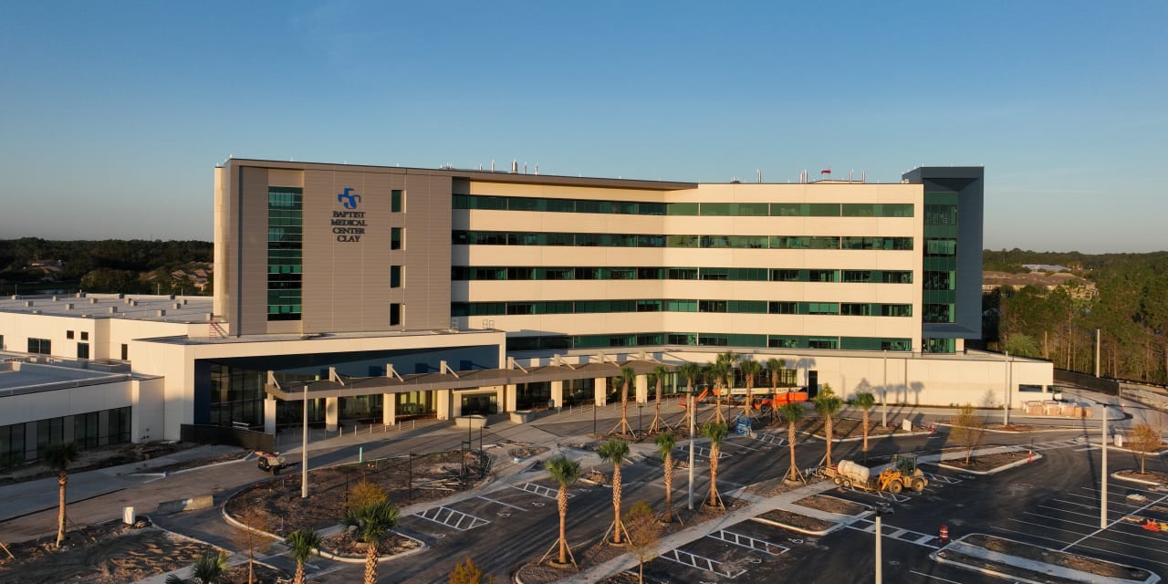 aerial photograph of the Baptist Medical Center Clay building with morning light shining on the front of building and blue skies behind.