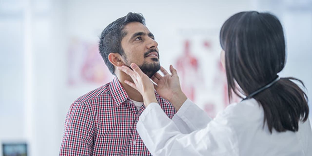 A patient being checked for HPV-related throat cancer