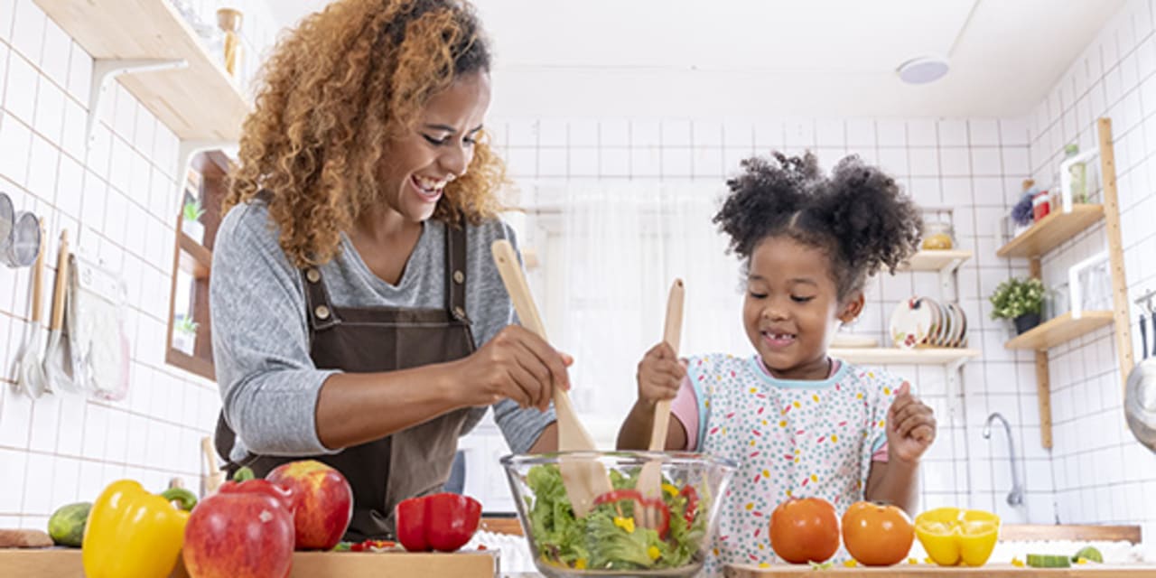 A mother and daughter cooking for diabetes