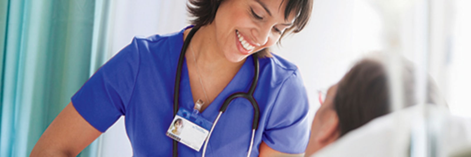 a healthcare provider checking on a patient