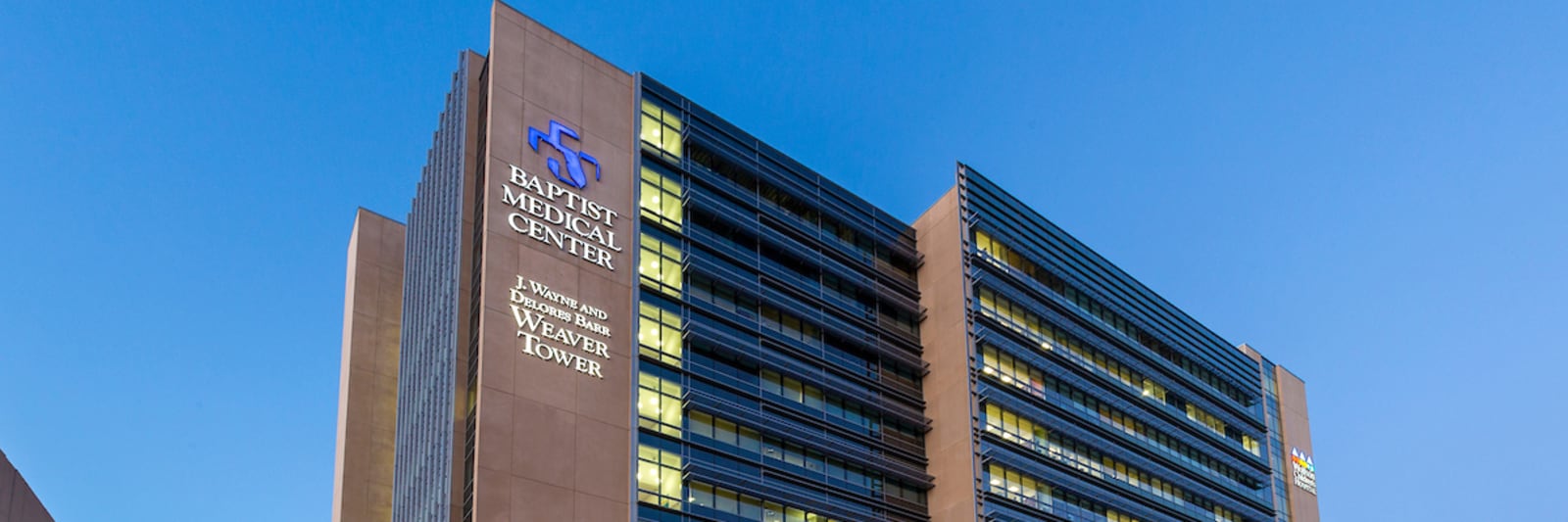exterior shot of the top of Baptist Medical Center - J Wayne and Delores Barr Weaver Tower