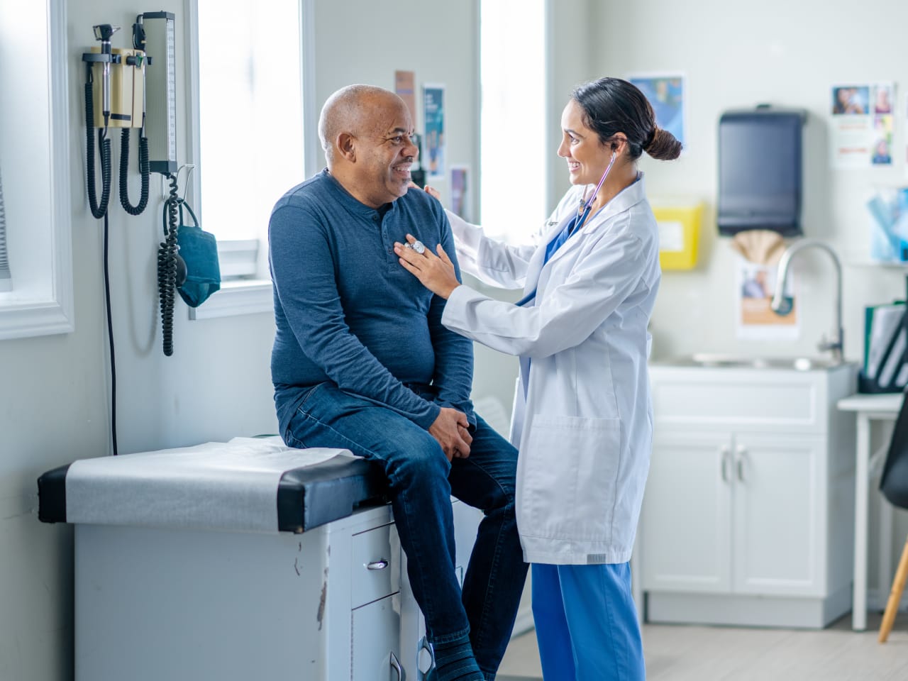 senior with provider in a doctor's office setting