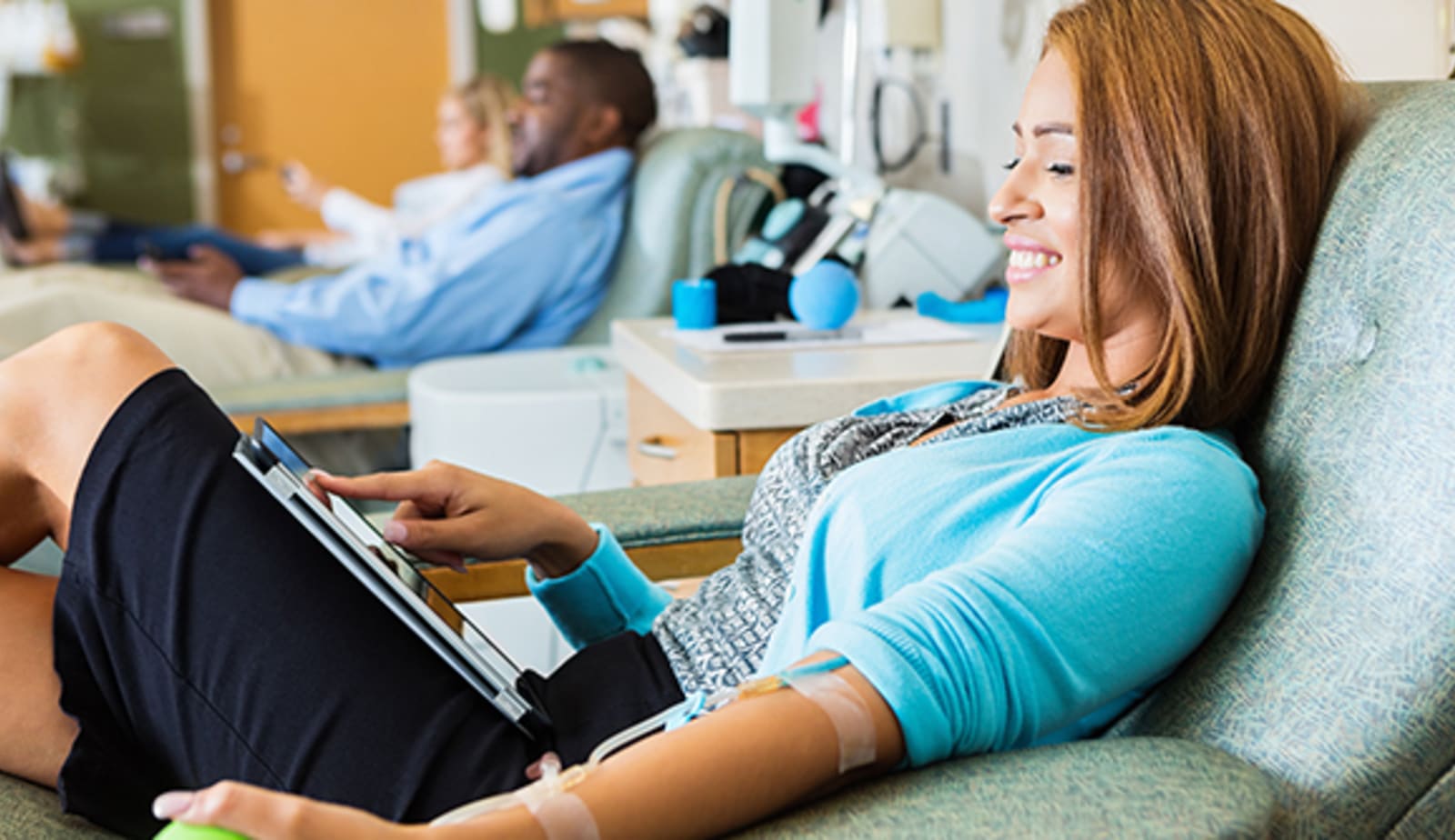 Man and woman donating blood