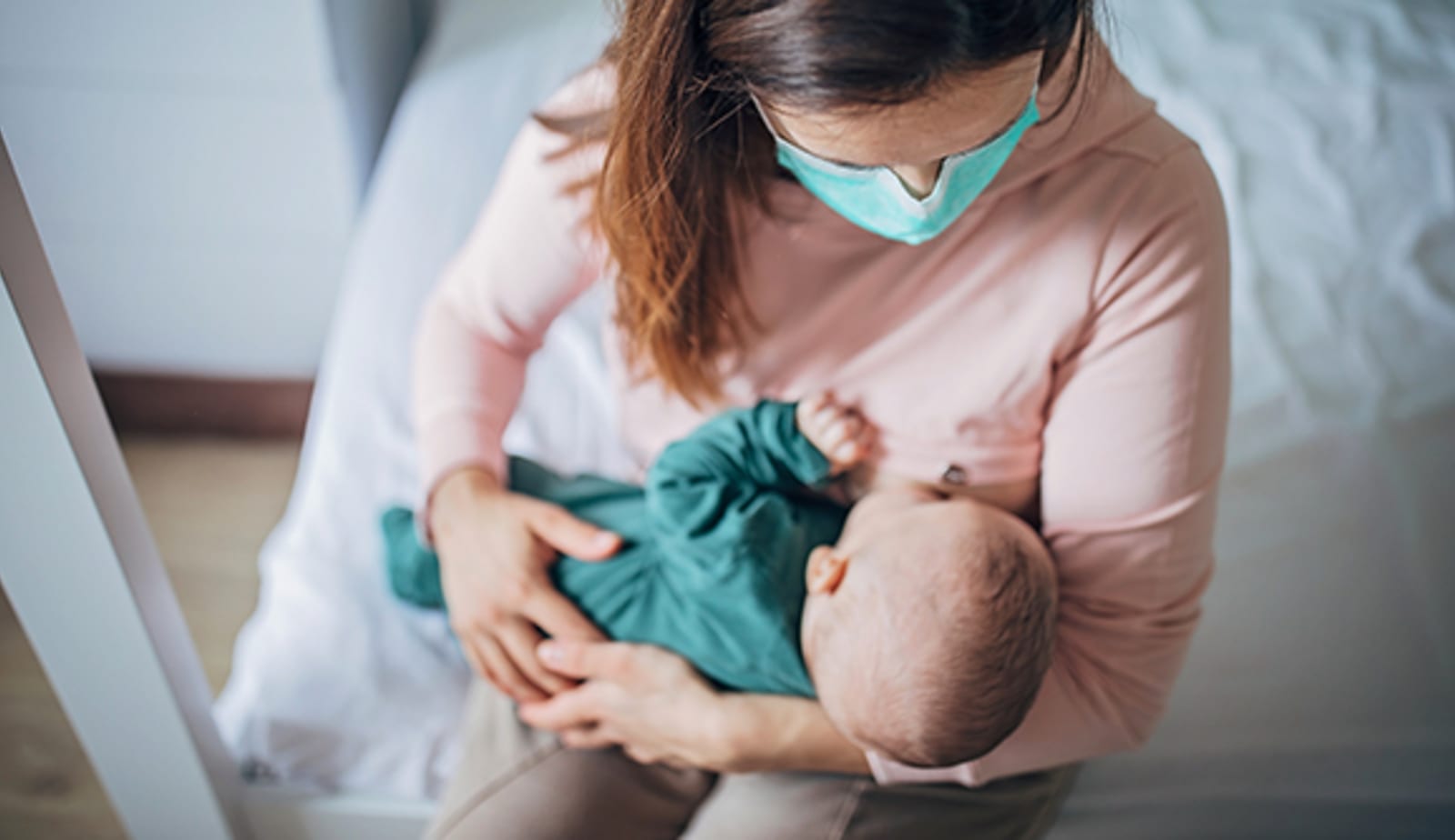 breastfeeding mother with baby
