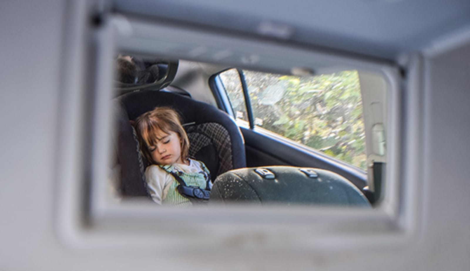 baby sleeping in a car seat