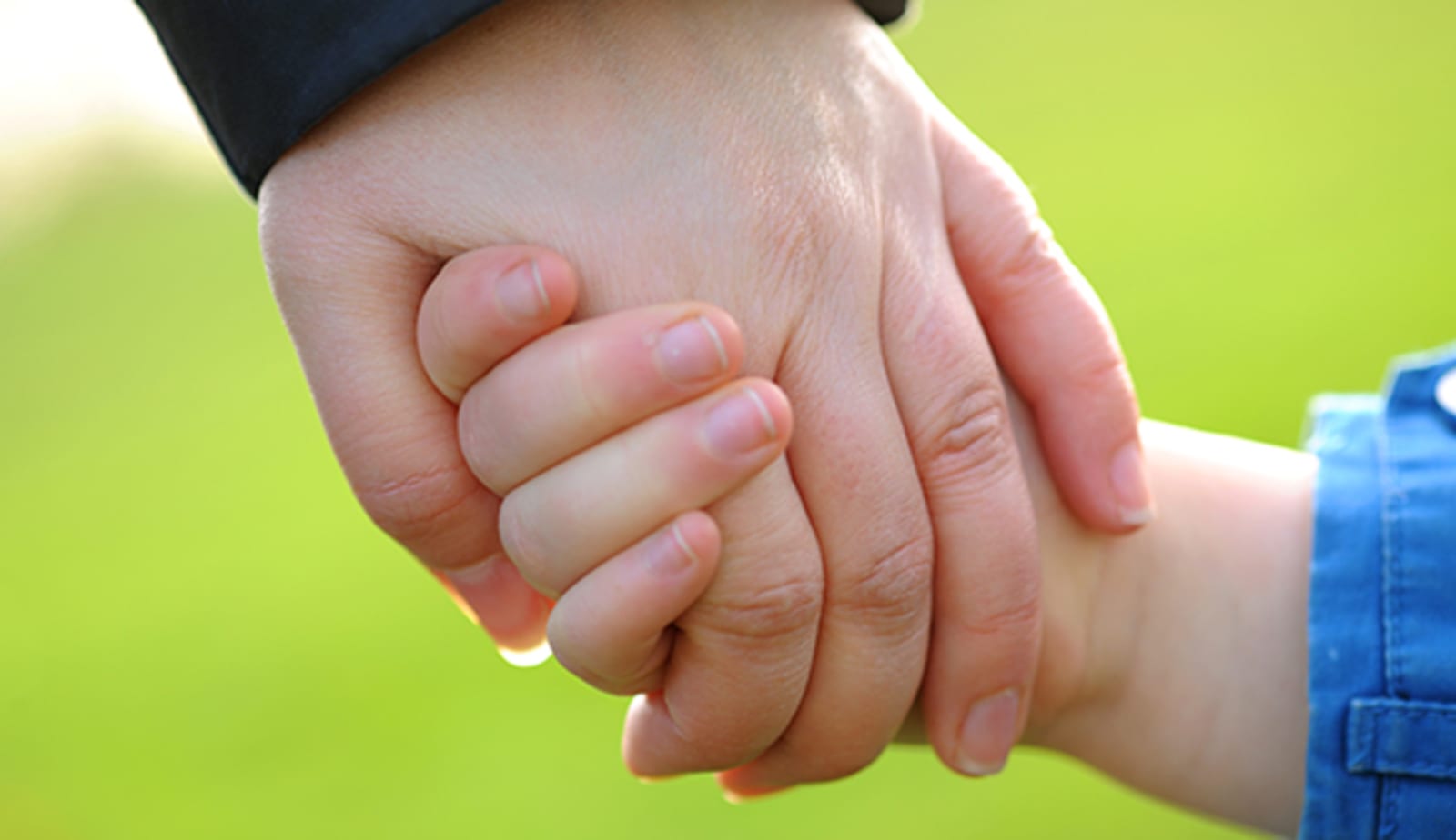 mom and daughter holding hands