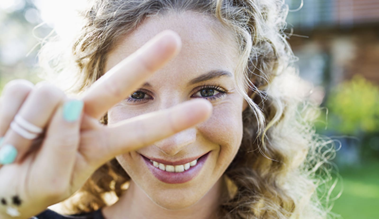 A woman holding up two fingers