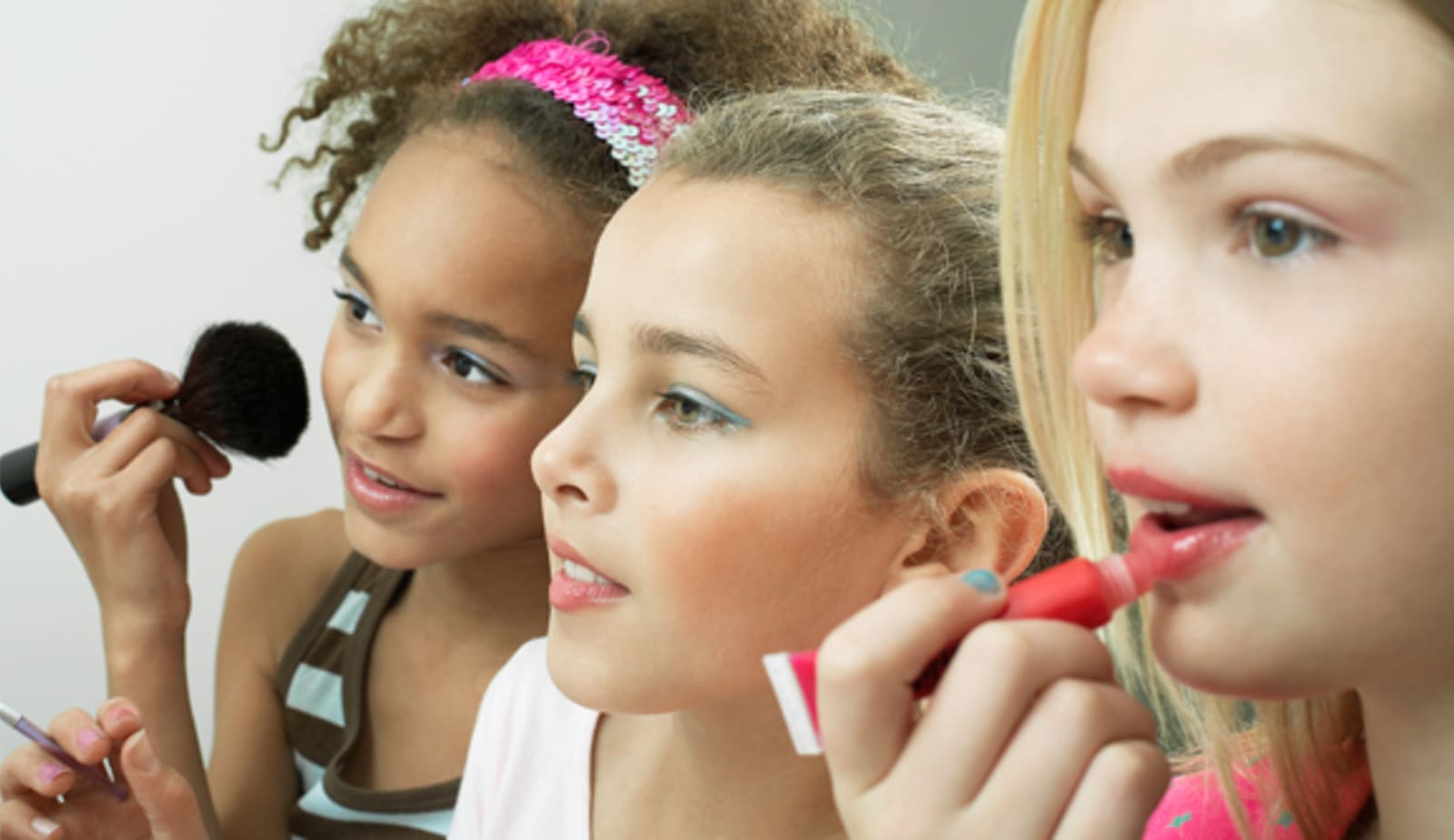 Little girls wearing make up