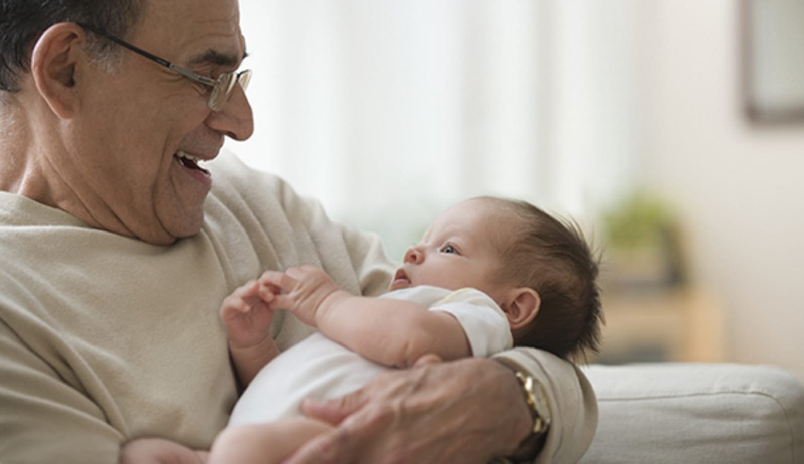 grandfather holding baby