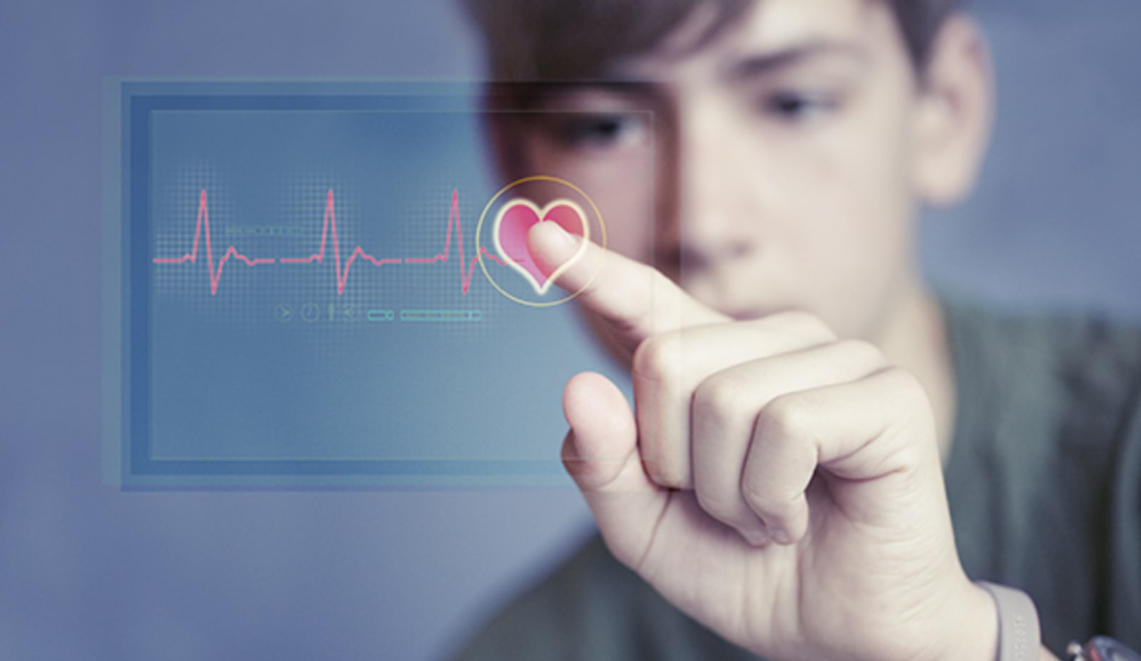 A teen looking at a heart rhythm report