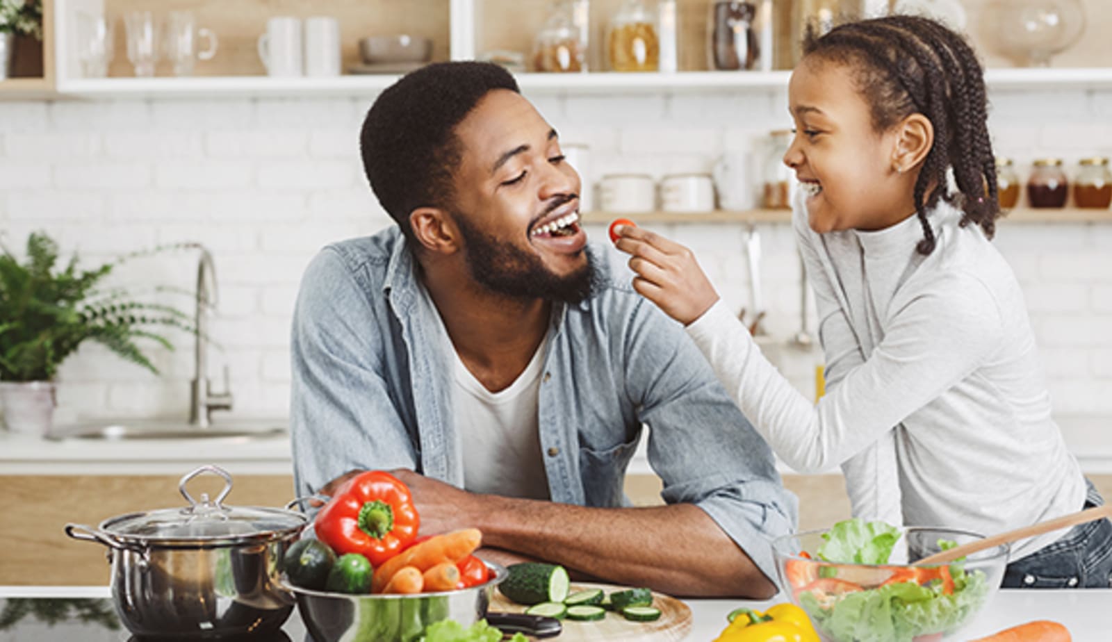 daughter and dad bonding in the kitchen