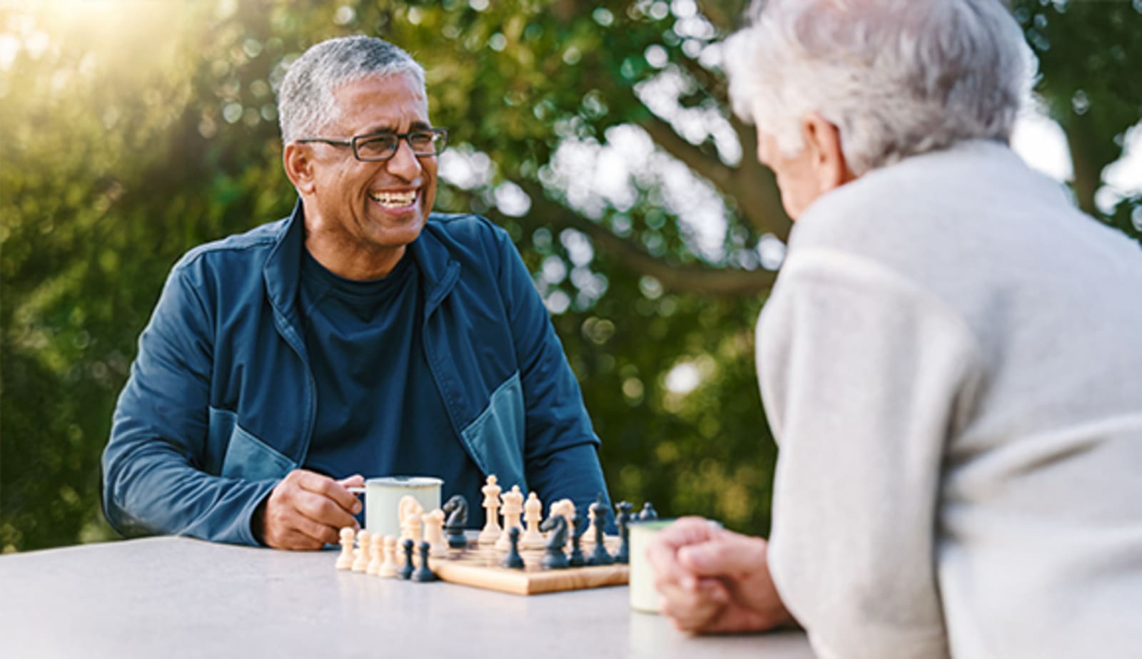An older couple playing chess