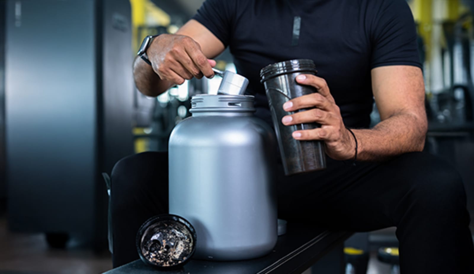 A man mixing up a pre-workout drink.