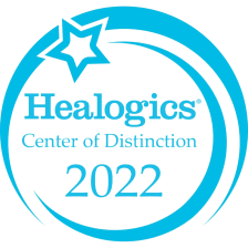 light blue and white award that says "Healogics center of Distinction 2022"