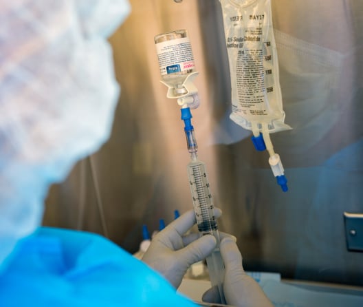pharmacist preparing meds for patient