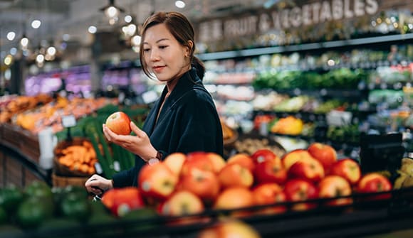 A shopper buying frest fruit at the store