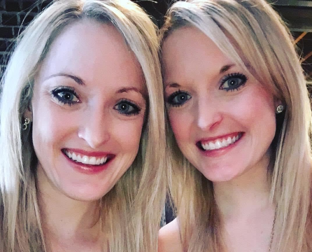 identical twin sisters, who are both practicing OBGYNs in Jacksonville smile together