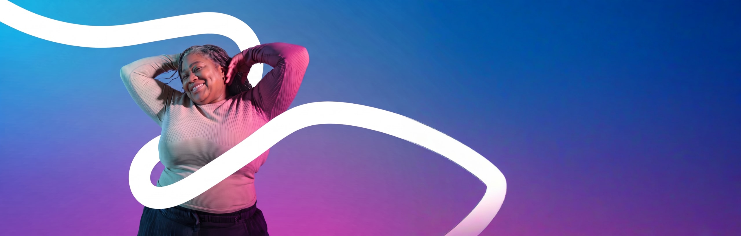 a smiling woman posing with her arms up with a white graphic running across the screen.